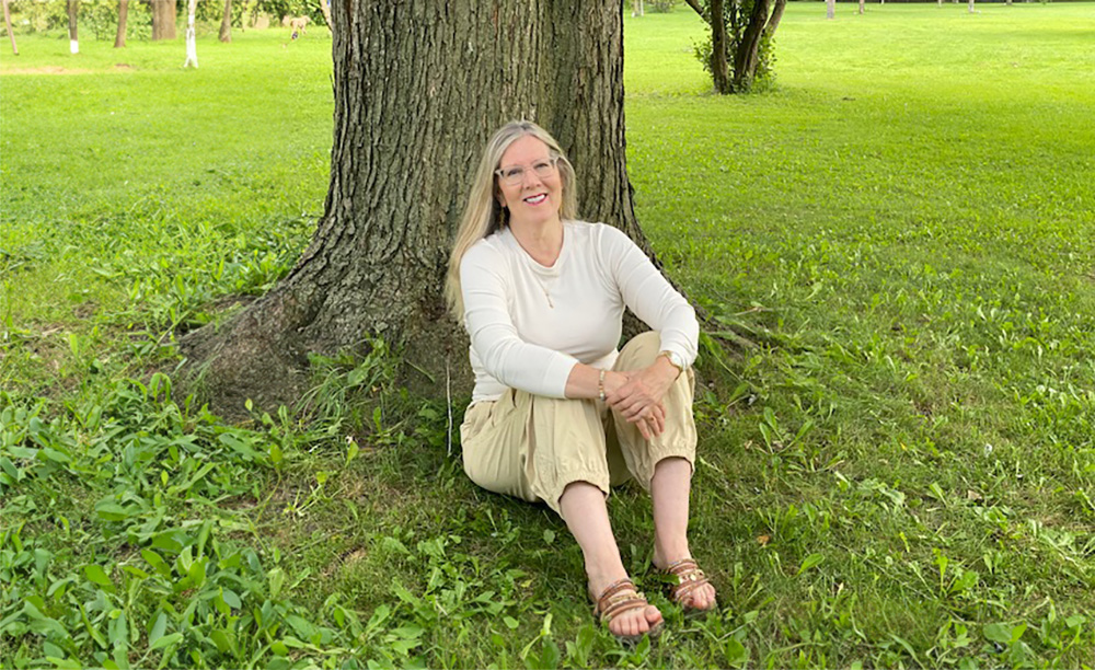 Linda Rose Cooper sitting in the park.